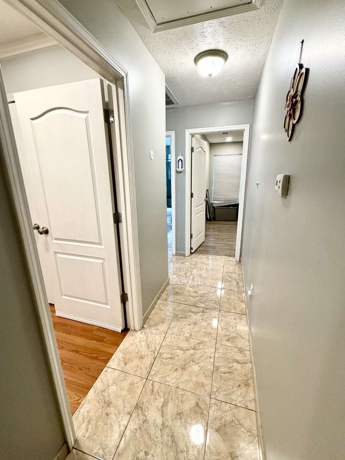 Hallway leading to all 3 bedrooms