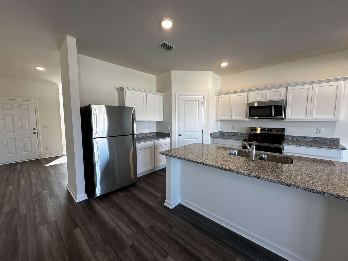 Large open concept kitchen with granite countertops