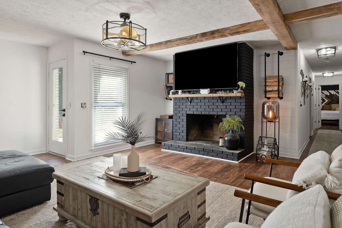 Wide-open living room with designer Fandelier