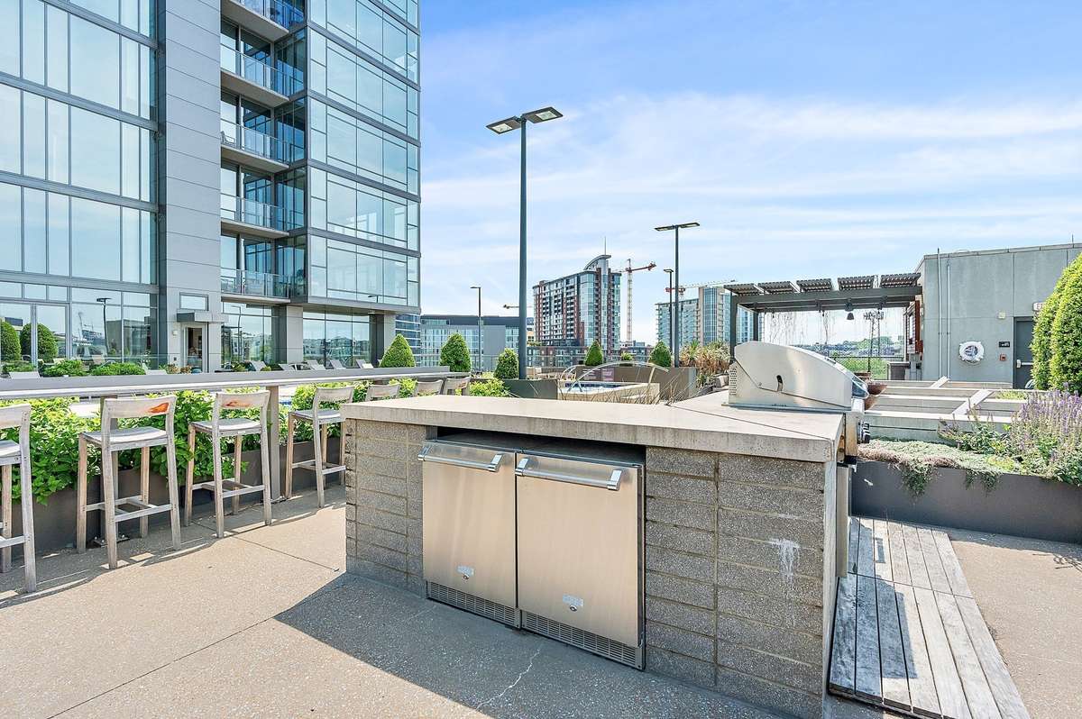 Multiple outdoor cooking and dining areas
