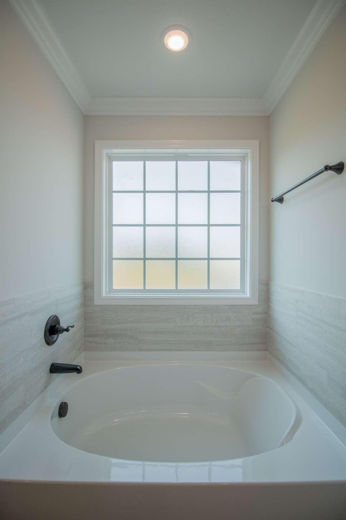 EXAMPLE>>> Soaker Tub with a Frosted Window and Tile Surrounding! Perfect to Relax in After a Long Day!