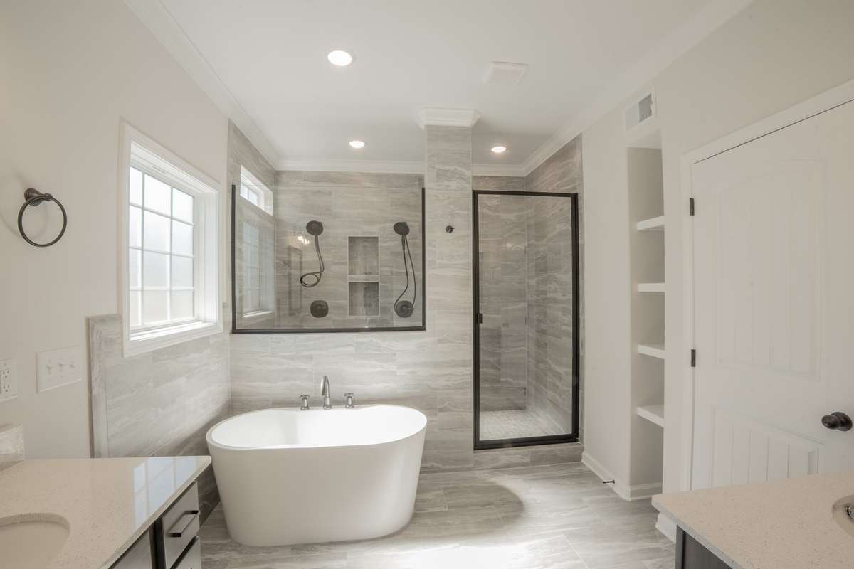 EXAMPLE>>> Primary Bathroom Features Separate Vanities, Huge Tile Shower, Freestanding Tub & a Toilet Closet!