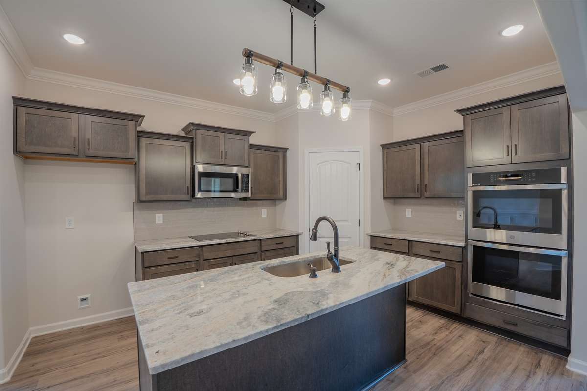 EXAMPLE>>> Kitchen Features Granite Counter Tops, Cabinets w/ Soft Close Doors & Drawers, Island, Double Oven & Cooktop!