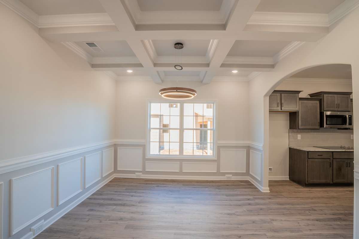 EXAMPLE>>> Large Formal Dining Room with Chair Railing, Wainscoting and Coffered Ceiling!