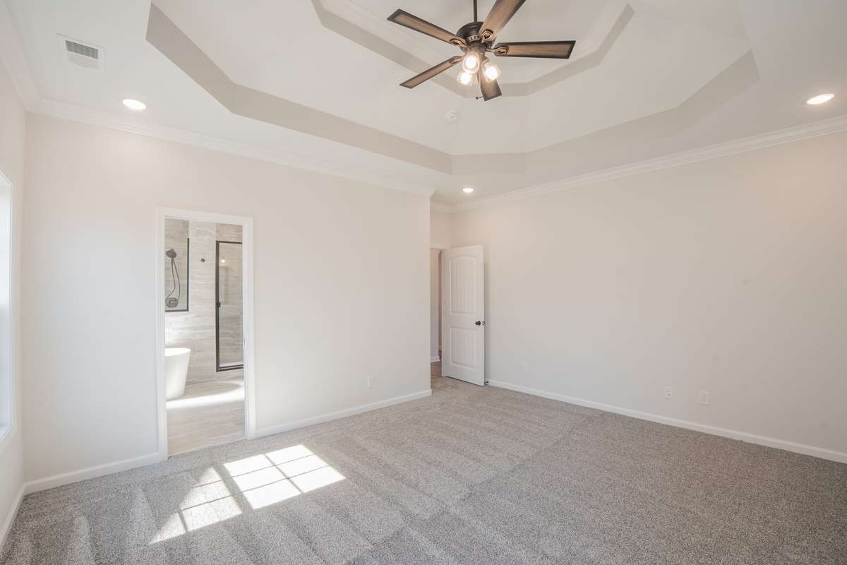 EXAMPLE>>> Primary Suite is Located on the Main Level & Features 2 Walk-in Closets, a Tray Ceiling & Recessed Lighting!