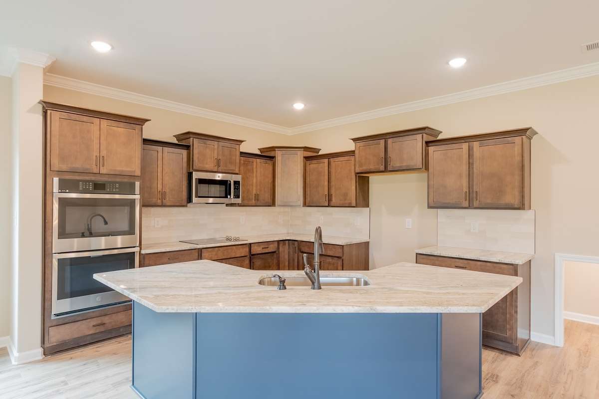 EXAMPLE>>>Large Kitchen with a Gas Cooktop, Smart Double Oven, Granite Countertops, Tile Backsplash, Recessed Lighting, Large Island and Lots of Cabinetry - All with Soft Close Doors and Drawers!!