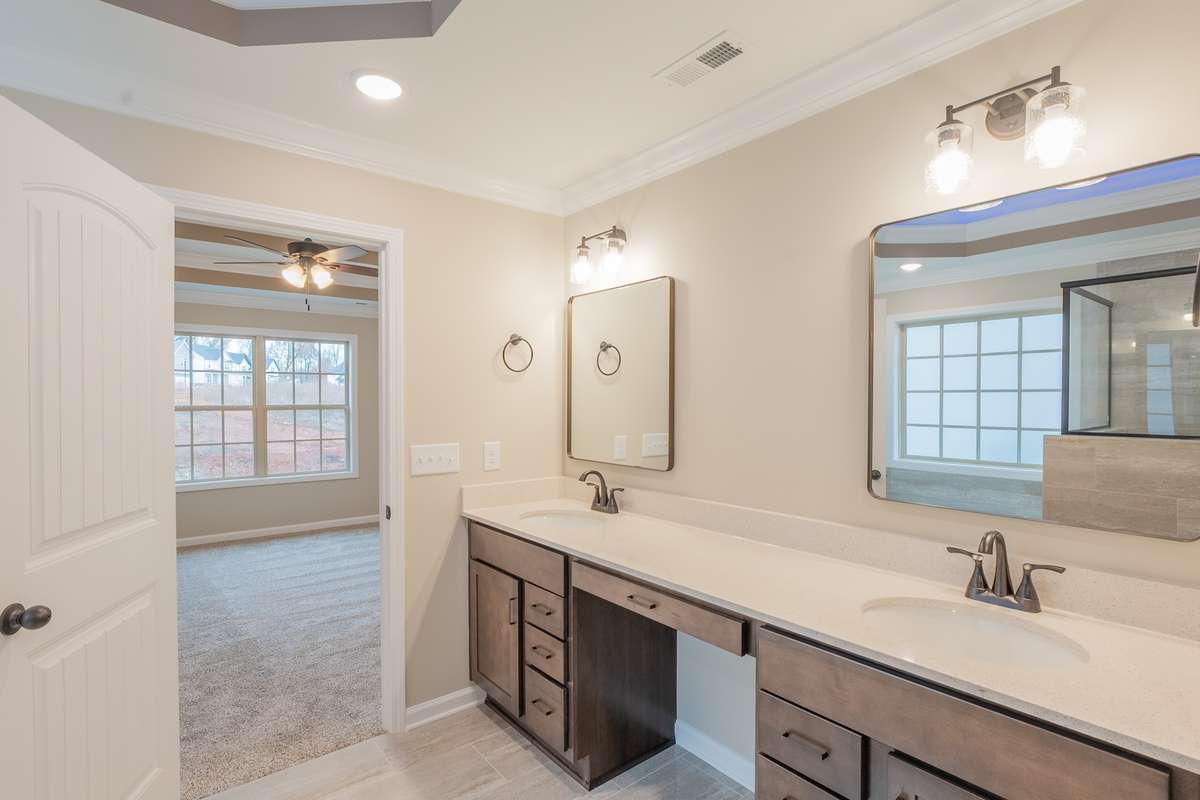 EXAMPLE>>>Double Vanity with Cosmetic Vanity in the Middle! Lots of Cabinet Storage, Modern Lighting and Large Mirrors!