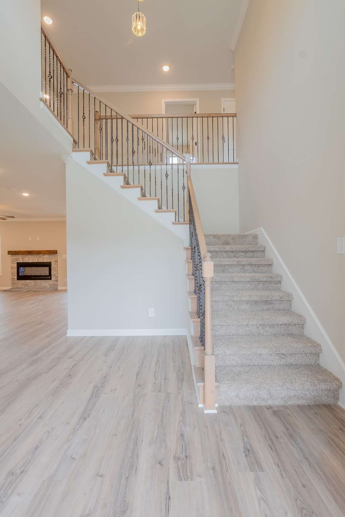 EXAMPLE>>>Large 2 Story Entry Foyer with an Elegant Staircase with Rod Iron Spindles & a Beautiful Chandelier!