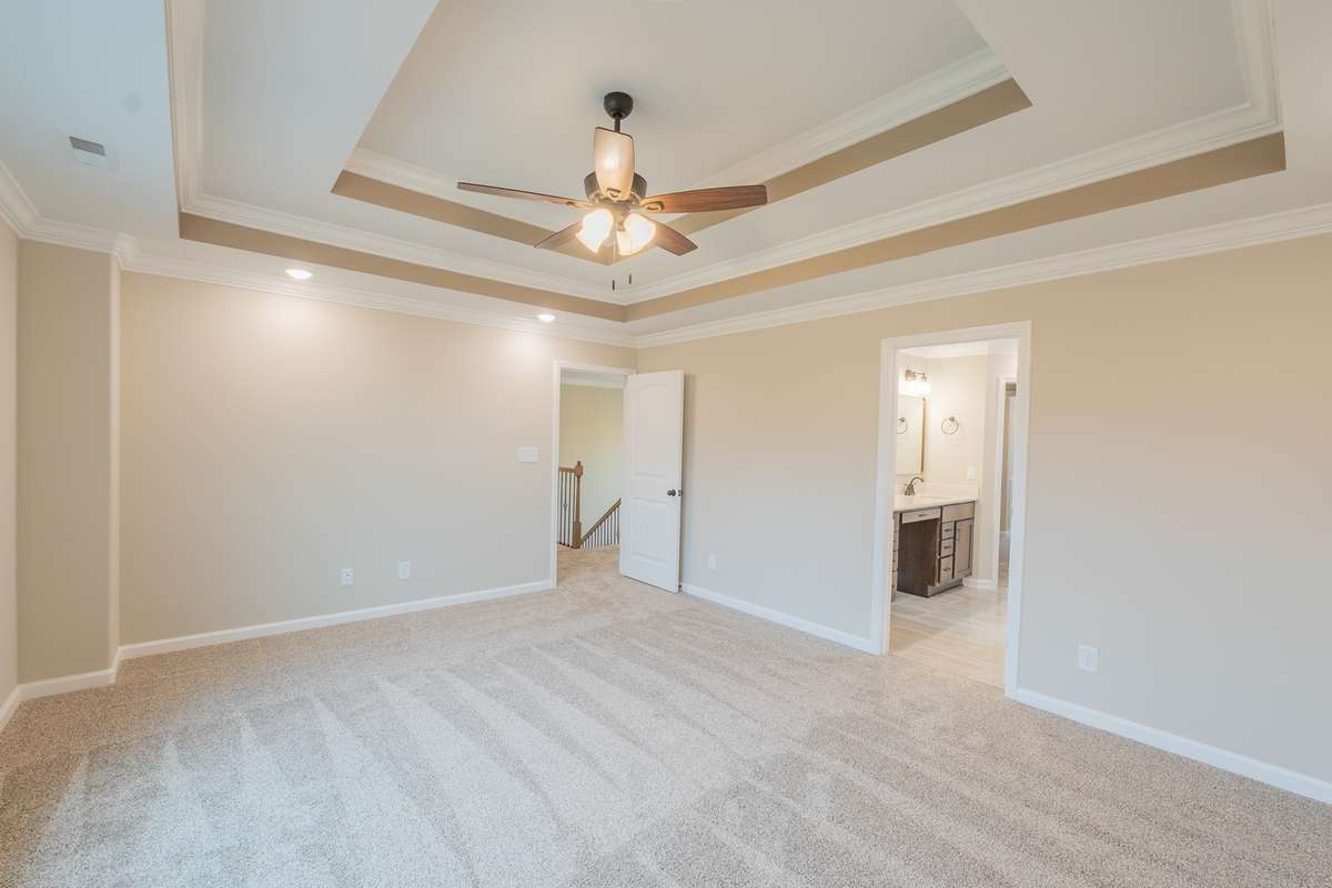 EXAMPLE>>>Primary Bedroom Features a Double Tray Ceiling, Crown Molding and Recessed Lighting!