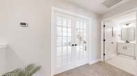 Top of stairs... French doors lead into the very large bonus room