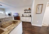 Added coffee/ drink station enlarges this kitchen space