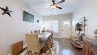 This space is versital, currently being used as a dining room but could also be a second living room space as well.