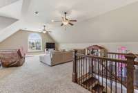 This large bonus room has tall ceilings & plenty of space for everyone to have dedicated areas of enjoyment.