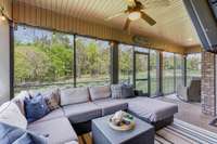 This screened porch will be a favorite place to spend time relaxing and enjoying the beautiful private view.