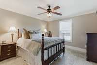 There is a large bedroom with a full bath upstairs.