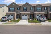 Town Home with a single bay garage and community irrigation and landscaping
