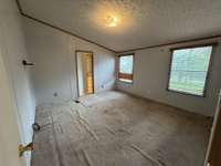 This home features a split bedroom plan, providing great privacy! This is the primary bedroom.