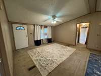 Living room with ceiling fan.