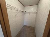 Walk-in closet for the third bedroom.