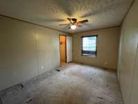 Second bedroom has ceiling fan along with walk-in closet.