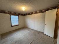 Third bedroom located on front of home also has walk-in closet.
