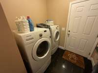 Washer and dryer included. Door leads to garage for the utility room to double as a mud room.