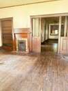 Entry/living room with amazing original woodwork