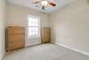 The bedroom with ceiling fan.