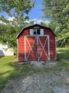 Storage building conveys with the home.