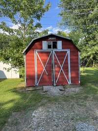 Storage building conveys with the home.