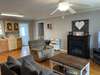 Neutral paint and crown molding adorn this open concept living space