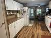 LOADS OF CABINET SPACE AND COUNTER SPACE FOR THAT CHEF IN YOUR LIFE. EAT IN KITCHEN MAKES IT EASY TO ENTERTAIN AND CLEAN UP. NOT JUST AN EAT IN KITCHEN, ALSO A FORMAL DINING AREA.  