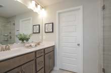 (Photos of Model Home) Dual raised vanity with optional linen closet with Choice-A bathroom.