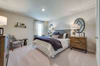 Large upstairs bedroom  *Photo of decorated model home