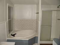 Master bath with corner tub and separate shower to right