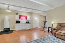 Kitchenette and living room of the addition/In law suite. Private entrance from the pool area or the second deck. 