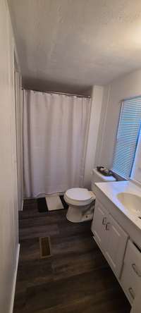 Primary bath and closet with bedroom.