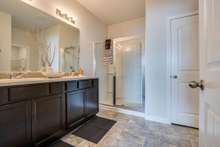 Comfort height double vanity & 5 foot wide shower.