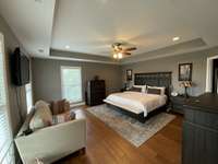 17 x 17 Main bedroom with tray ceiling has ample room for large furniture.