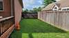 Side yard with entry gate from front.  Perfect for playing horseshoes or corn hole!