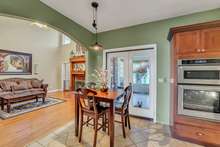 Eat in kitchen area and view into living room. 