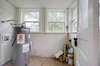 Laundry / utility storage room off the back of the home; NEW water heater in 2021