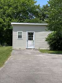 Storage building, great potential with heating and air.  Could be a man cave/she shed or office or possibly a studio rental if finished out.  