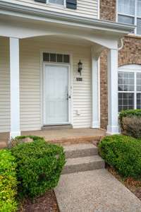 Front of unit with covered porch. HOA fees include care of all landscaping. 