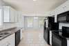 Kitchen offers an abundance of cabinets and counter space. 