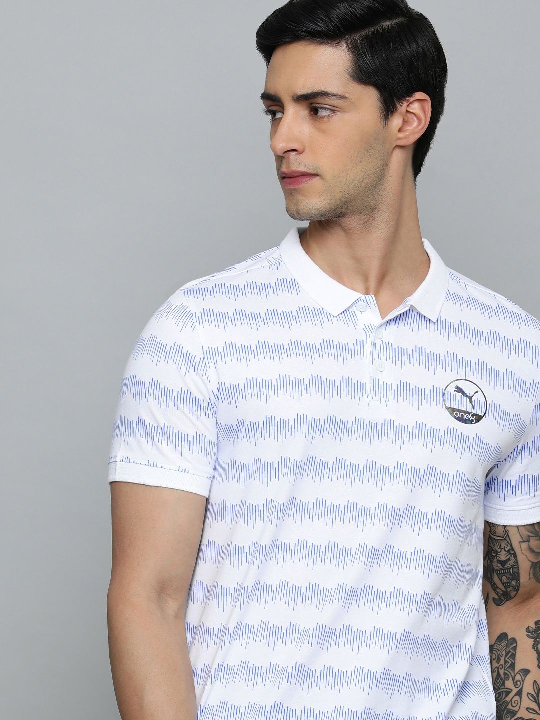 Myntra - one8 x PUMA Men Pure Cotton Geometric Printed Polo Collar Slim Fit Outdoor T-shirt