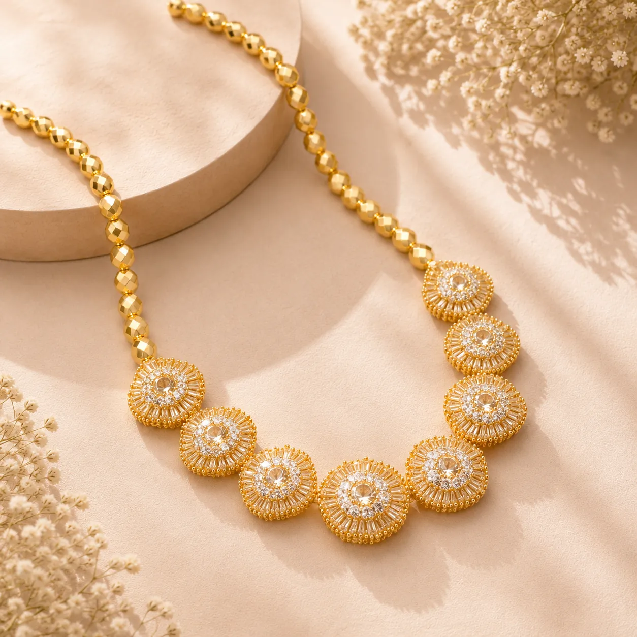 Gold-plated-statement-necklace-with-circular-crystal-floral-motifs-faceted-bead-chain-and-cubic-zirconia-embellishments
