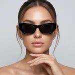 Woman-wearing-glossy-black-cat-eye-sunglasses-with-dark-tinted-lenses-and-sleek-narrow-frame-design