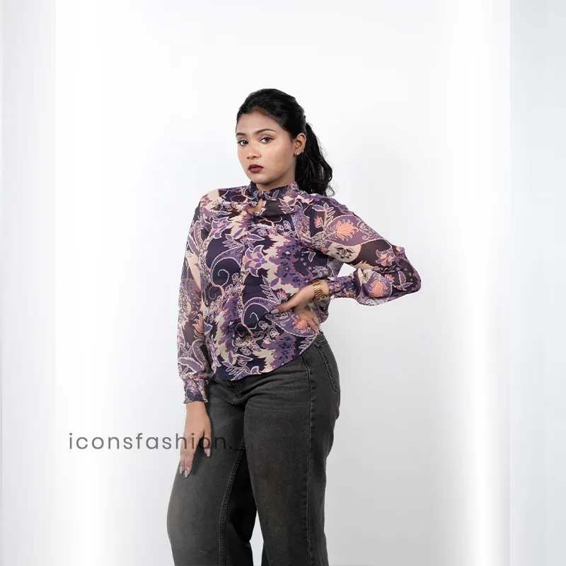 Women-wearing-a-purple-floral-print-high-neck-top-with-full-sleeves-mock-detailing-and-a-relaxed-fit-design