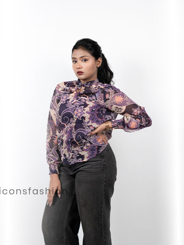 Women-wearing-a-purple-floral-print-high-neck-top-with-full-sleeves-mock-detailing-and-a-relaxed-fit-design